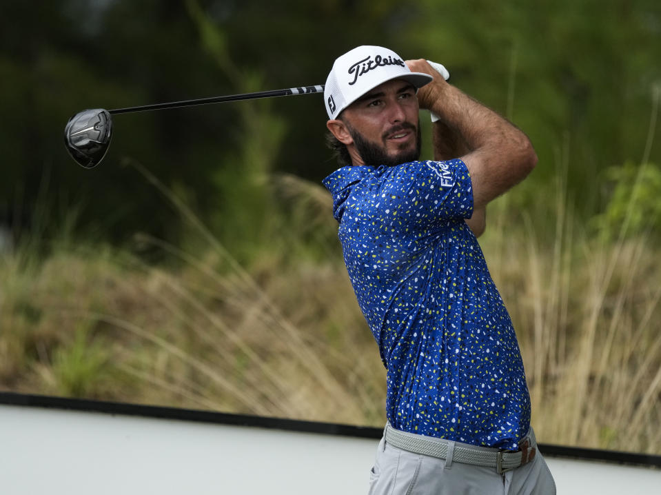 Max Homa, of the United States, watches his shot on the 10th tee during a practice round of the Hero World Challenge PGA Tour at the Albany Golf Club, in New Providence, Bahamas, Wednesday, Nov. 30, 2022. (AP Photo/Fernando Llano)