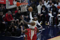 Los Angeles Lakers forward LeBron James (6)goes to the basket against New Orleans Pelicans forward Herbert Jones (5) and forward Naji Marshall (8) in the first half of an NBA basketball game in New Orleans, Saturday, Feb. 4, 2023. (AP Photo/Gerald Herbert)