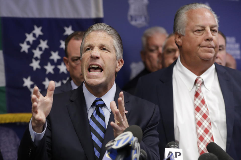 Police Benevolent Associaton President Patrick J. Lynch, left, speaks with NYPD officer Daniel Pantaleo's attorney Stuart London beside him, right, during a press conference at PBA headquarters following a decision to terminate Pantaleo, Monday, Aug. 19, 2019, in New York. Pantaleo was involved in the chokehold death of Eric Garner. T (AP Photo/Kathy Willens)