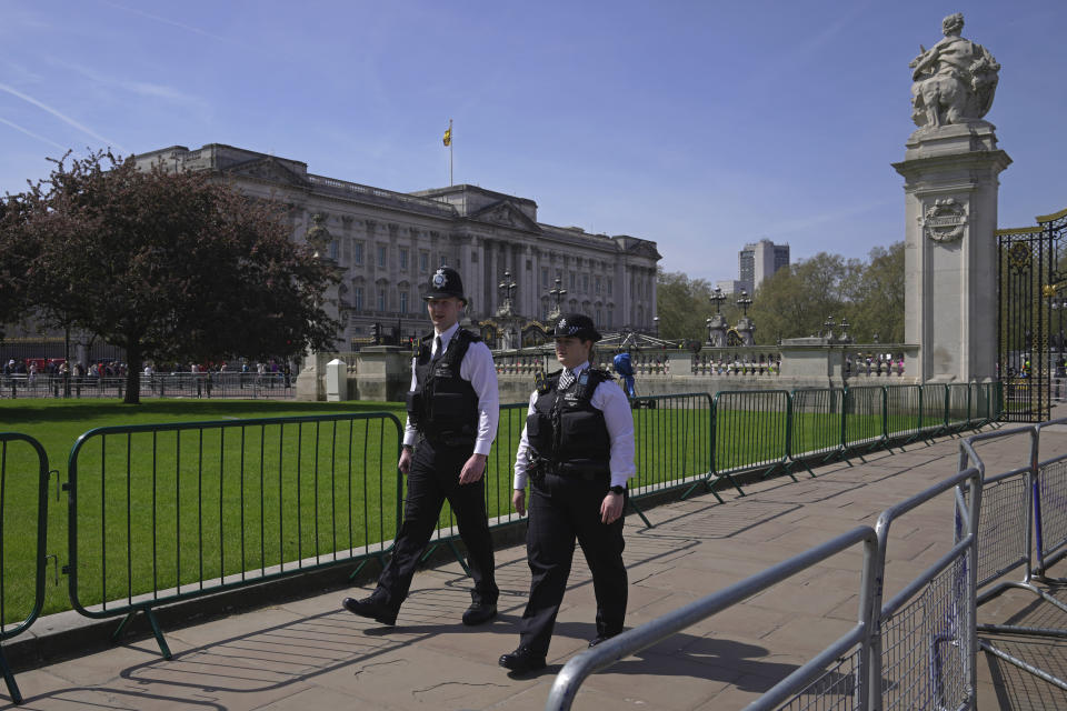 Police officers patrol outside Buckingham Palace in London, Wednesday, May 3, 2023. The Coronation of King Charles III will take place at Westminster Abbey on May 6. (AP Photo/Kin Cheung)