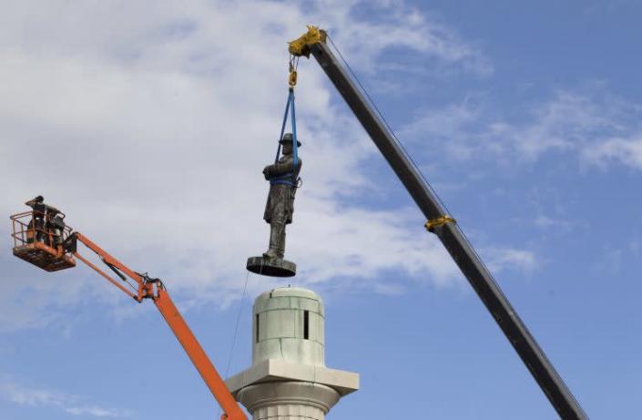 A statue of Confederate General Robert E. Lee being removed from a pedestal in New Orleans