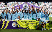 <p>Soccer Football – Premier League – Manchester City vs Huddersfield Town – Etihad Stadium, Manchester, Britain – May 6, 2018 Manchester City celebrate with the trophy after winning the Premier League title REUTERS/Phil Noble EDITORIAL USE ONLY. No use with unauthorized audio, video, data, fixture lists, club/league logos or “live” services. Online in-match use limited to 75 images, no video emulation. No use in betting, games or single club/league/player publications. Please contact your account representative for further details. </p>