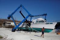 A destroyed crane and a boat are seen at a marina after Hurricane Dorian hit the Abaco Islands in Marsh Harbour