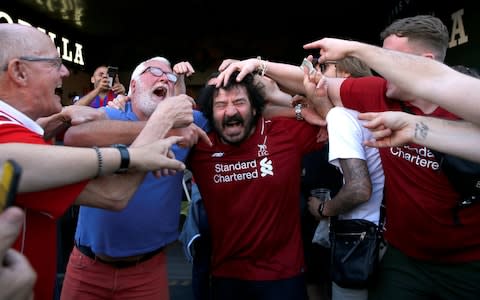 Liverpool fans outside the stadium before the match  - Credit: REUTERS/Susana Vera