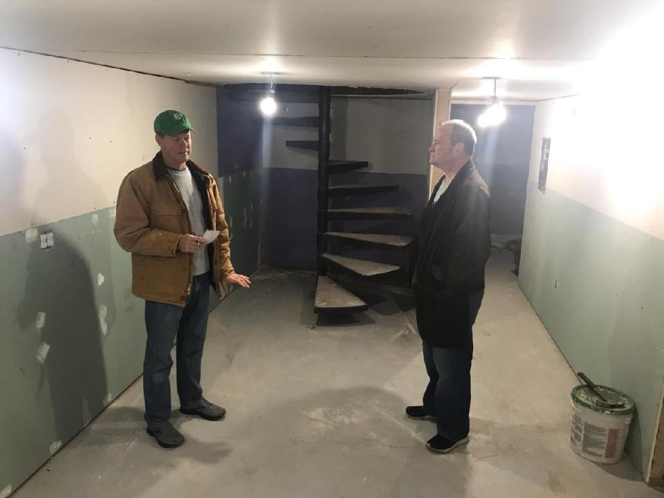 The space for the juice bar long-slated to open in downtown Port Huron's Ballentine building includes a basement where Jeff Payton, who owns the Vintage Tavern, and long-time friend Craig Becker, right, said they plan to refrigerator an array of produce and keep a wheatgrass grow operation.