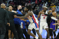 Detroit Pistons center Isaiah Stewart (28) is held back after a foul during the second half of an NBA basketball game against the Los Angeles Lakers, Sunday, Nov. 21, 2021, in Detroit. (AP Photo/Carlos Osorio)