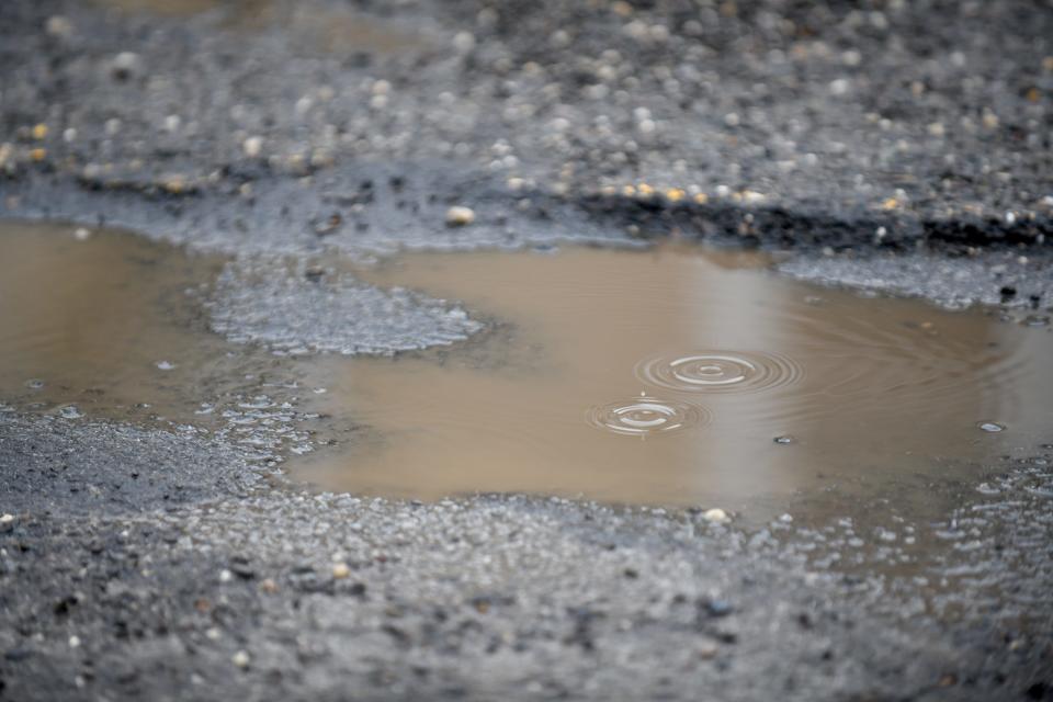 Potholes on 34th Street NW in Canton.  Monday,  February 22, 2022. 