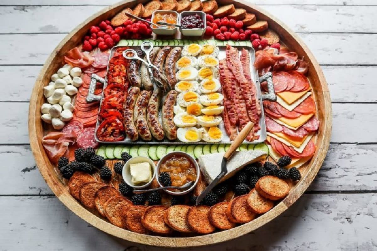 <p>Reluctant Entertainer</p><p>Serve an epic grilled breakfast charcuterie board filled with grilled meat, cheese and soft-boiled eggs. Add fruit and summer jams for easy entertaining.</p><p><strong>Get the recipe: </strong><a href="https://reluctantentertainer.com/epic-grilled-breakfast-charcuterie-board/" rel="nofollow noopener" target="_blank" data-ylk="slk:Epic Grilled Breakfast Charcuterie Board;elm:context_link;itc:0;sec:content-canvas" class="link rapid-noclick-resp"><strong>Epic Grilled Breakfast Charcuterie Board</strong></a></p>