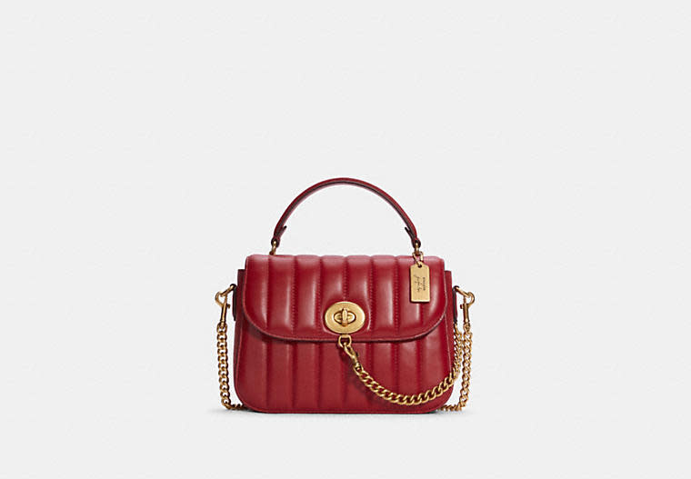 Coach X Jennifer Lopez Marlie Top Handle Satchel With Linear Quilting. Image via Coach Outlet.