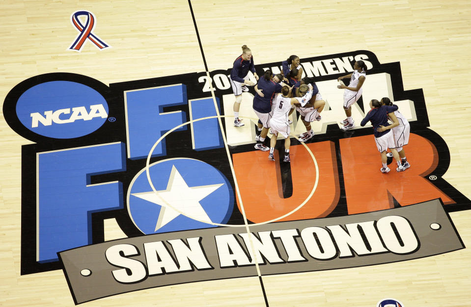 FILE - Connecticut players celebrate following the women's NCAA Final Four college basketball championship game against Stanford in San Antonio, in this Tuesday, April 6, 2010, file photo. Connecticut won 53-47. The San Antonio region will host the entire NCAA women's basketball tournament. The move Friday, Feb. 5, 2021, was made to help mitigate the risks of COVID-19 and matches that of the men’s tournament, which the NCAA said last month will be played in the Indianapolis area.(AP Photo/Eric Gay, File)