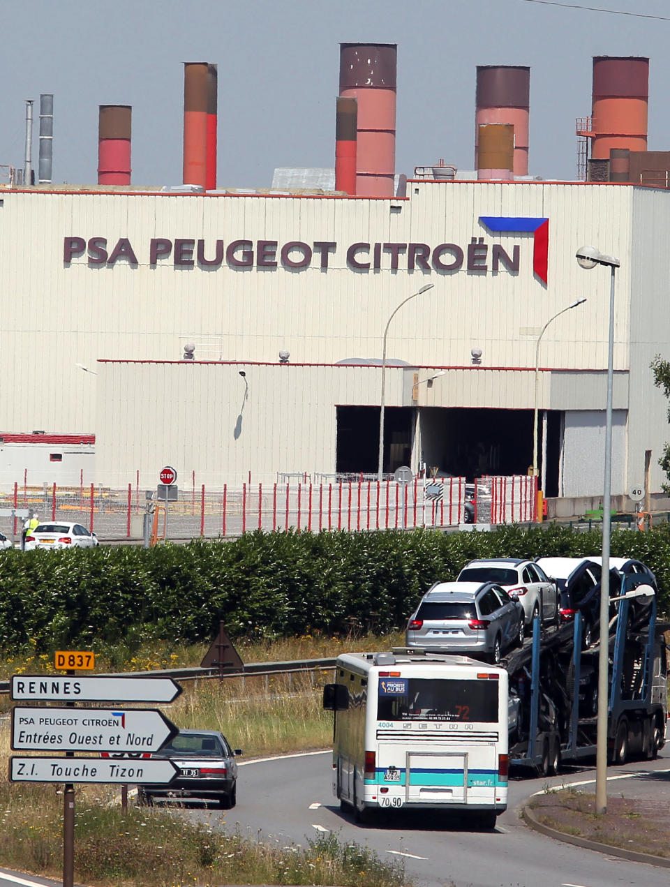 FILE - This July 26, 2012 file photo shows the PSA Peugeot Citroen factory of Rennes, western France. France is offering a euro7 billion ($9.1 billion) lifeline to PSA Peugeot Citroen, the carmaker confirmed Wednesday, Oct.24, 2012 alongside another drop in sales. In return, the Socialist government is expected to demand a reduction in layoffs, hoping to blunt rising unemployment in a sector critical to the French economy. (AP Photo/David Vincent, File)