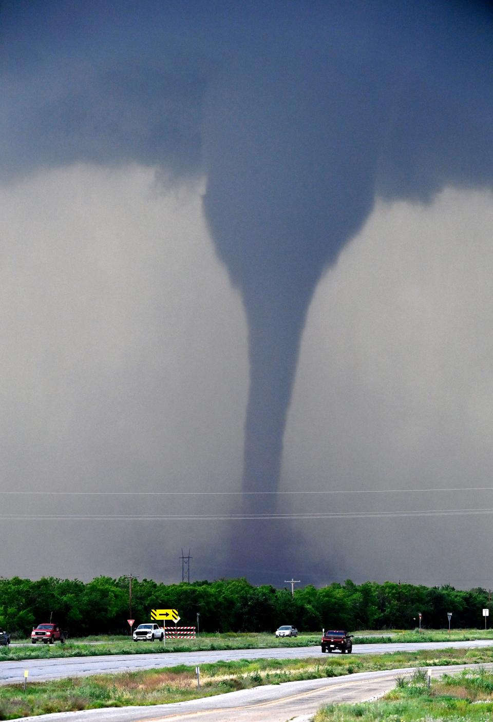 A tornado spins west of Hawley, Texas as cars pass on U.S. 277 May 2, 2024.