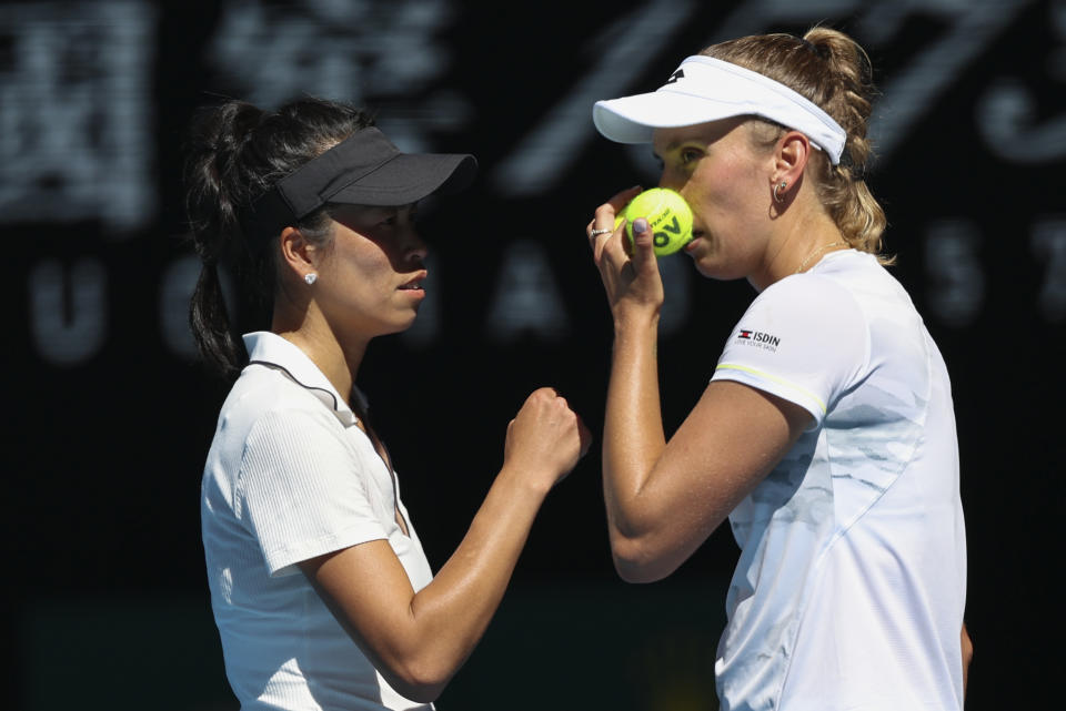 Hsieh Su-Wei, left, of Taiwan and Elise Mertens of Belgium talk during the women's doubles final against Jelena Ostapenko of Latvia and Lyudmyla Kichenok of Ukraine at the Australian Open tennis championships at Melbourne Park, in Melbourne, Australia, Sunday, Jan. 28, 2024. (AP Photo/Asanka Brendon Ratnayake)