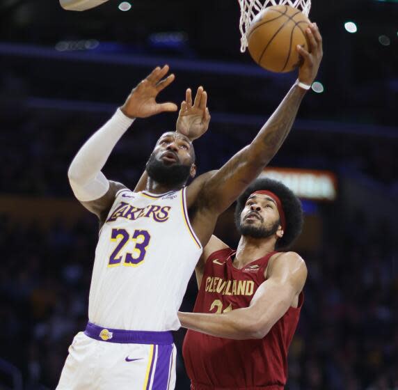 Los Angeles, CA - April 06: Lakers forward LeBron James, #23, left, goes to the basket.