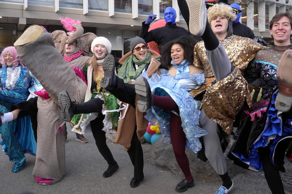 Actor Annette Bening, center, Hasty Pudding 2024 Woman of the Year, dances with Harvard University theatrical students, Tuesday, Feb. 6, 2024, following a parade through Harvard Yard, in Cambridge, Mass. The award was presented to Bening by Hasty Pudding Theatricals, a theatrical student society at Harvard University. (AP Photo/Steven Senne)