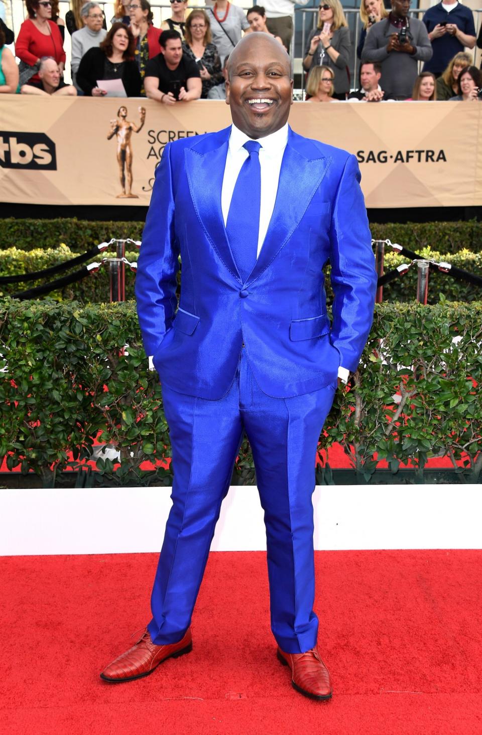 Tituss Burgess made quite a style statement in an electric blue suit