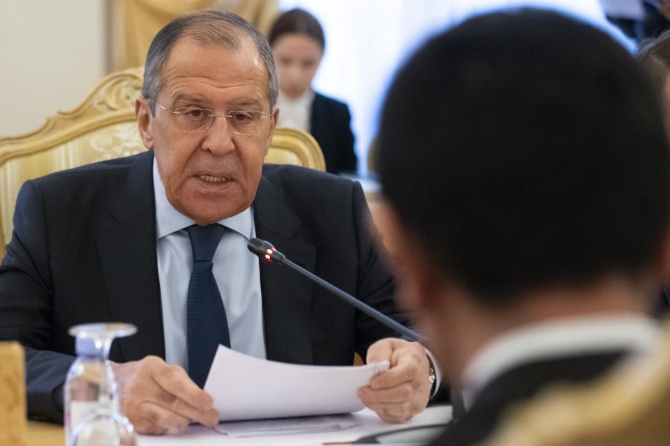 Russian Foreign Minister Sergey Lavrov, left, speaks to Japanese Foreign Minister Taro Kono during their talks in Moscow, Russia, Monday, Jan. 14, 2019. (AP Photo/Alexander Zemlianichenko)