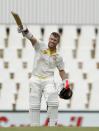 Australia's David Warner celebrates his hundred century during the third day of their cricket test match against South Africa in Centurion February 14, 2014. REUTERS/Siphiwe Sibeko (SOUTH AFRICA - Tags: SPORT CRICKET)