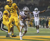 Kansas State running back Deuce Vaughn (22) score a touchdown past Baylor safety JT Woods (22) during the first half of an NCAA college football game Saturday, Nov. 28, 2020, in Waco, Texas. (Jerry Larson/Waco Tribune Herald via AP)