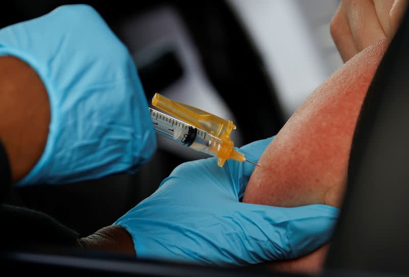 A nurse administers a dose of the Moderna COVID-19 vaccine during the outbreak of the coronavirus disease (COVID-19), in Pasadena