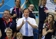 British Prime Minister David Cameron cheers for Eleanor Simmonds during her race in the Women's 200m IM SM6 Final at the 2012 Paralympics Olympics, Monday, Sept. 3, 2012, in London. (AP Photo / Emilio Morenatti)