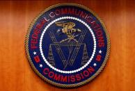 The Federal Communications Commission (FCC) logo is seen before the FCC Net Neutrality hearing in Washington February 26, 2015. REUTERS/Yuri Gripas