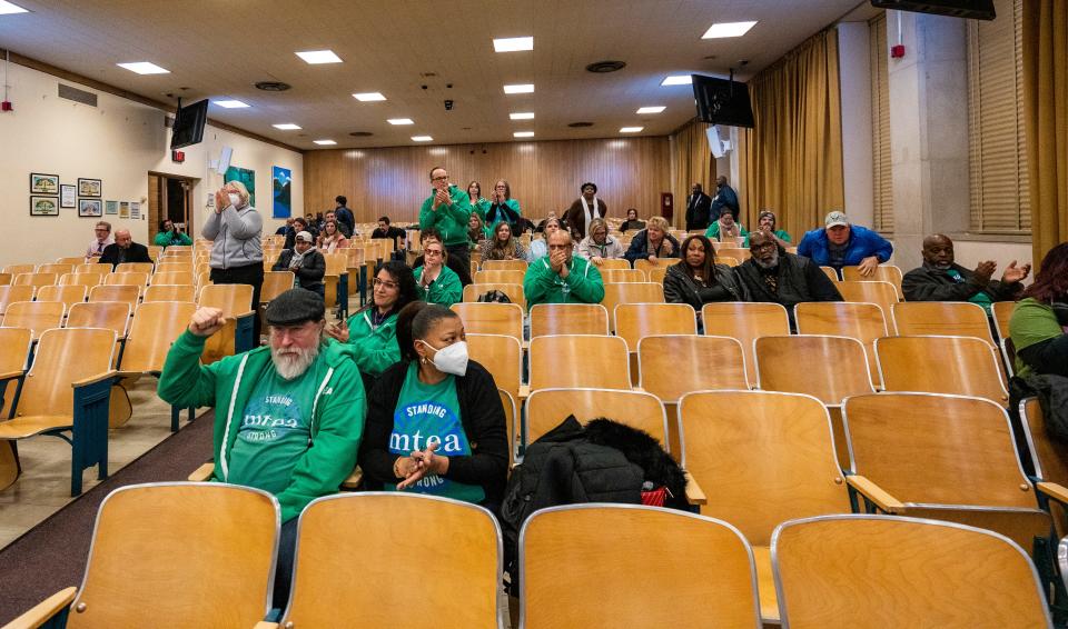 People applaud as the Milwaukee Board of School Directors vote to put a referendum on the spring ballot, asking voters to raise taxes for more school funding, on Thursday at the MPS Central Services Building in Milwaukee.