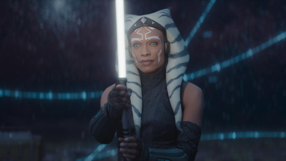 Ahsoka Tano holds up one of her lightsabers in her standalone Star Wars TV show on Disney Plus