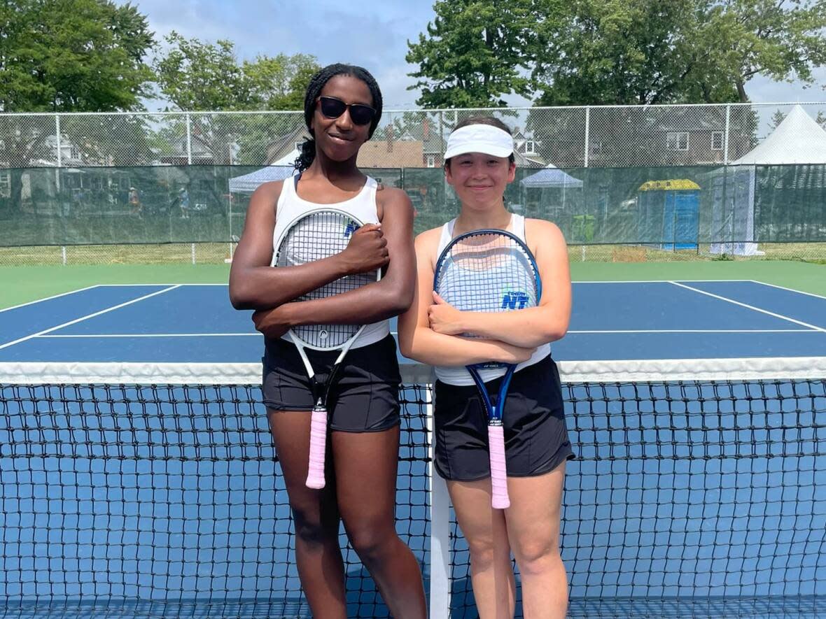 Ofira Duru, left, and Teresa Martin won their match against Newfoundland and Labrador in 3 sets, including a lengthy 7-6 win in the second set on Sunday. (Tennis NWT Facebook - image credit)