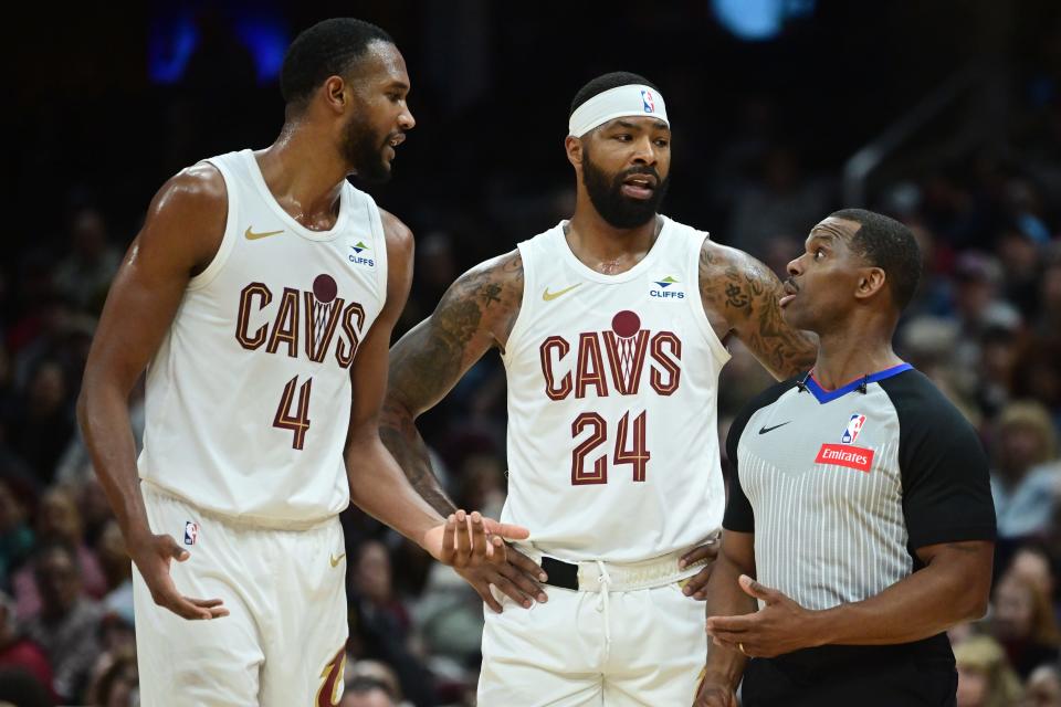 Mar 29, 2024; Cleveland, Ohio, USA; Cleveland Cavaliers forward Evan Mobley (4) and forward Marcus Morris Sr. (24) argue a call with referee Dedric Taylor (21) during the first half against the Philadelphia 76ers at Rocket Mortgage FieldHouse. Mandatory Credit: Ken Blaze-USA TODAY Sports