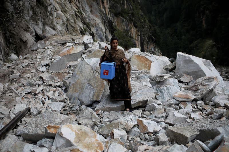 The Wider Image: Doctors scale rockslides, invoke gods to vaccinate Himalayan villages