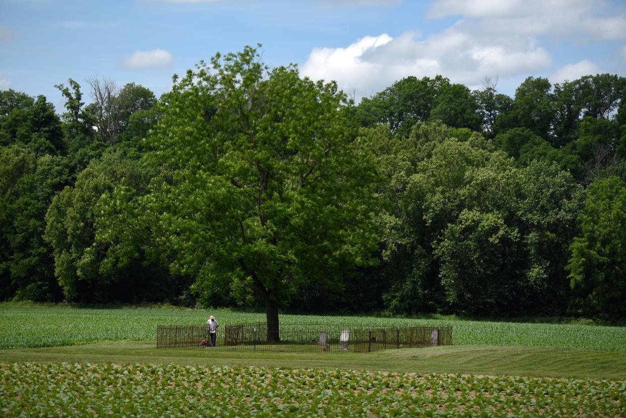 The Swinford family cemetery in Berry, Kentucky, holding the graves of Jim Swinford’s ancestors, sits under the shade of a large tree.
May 29, 2018