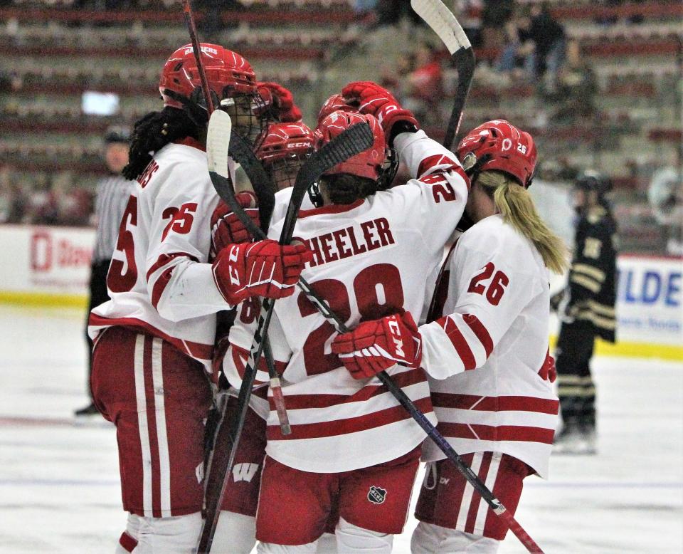 Wisconsin's Maddi Wheeler celebrates with teammates after assisting on the first goal of the Badgers' 6-0 win over Lindenwood on Thursday night at LaBahn Arena.