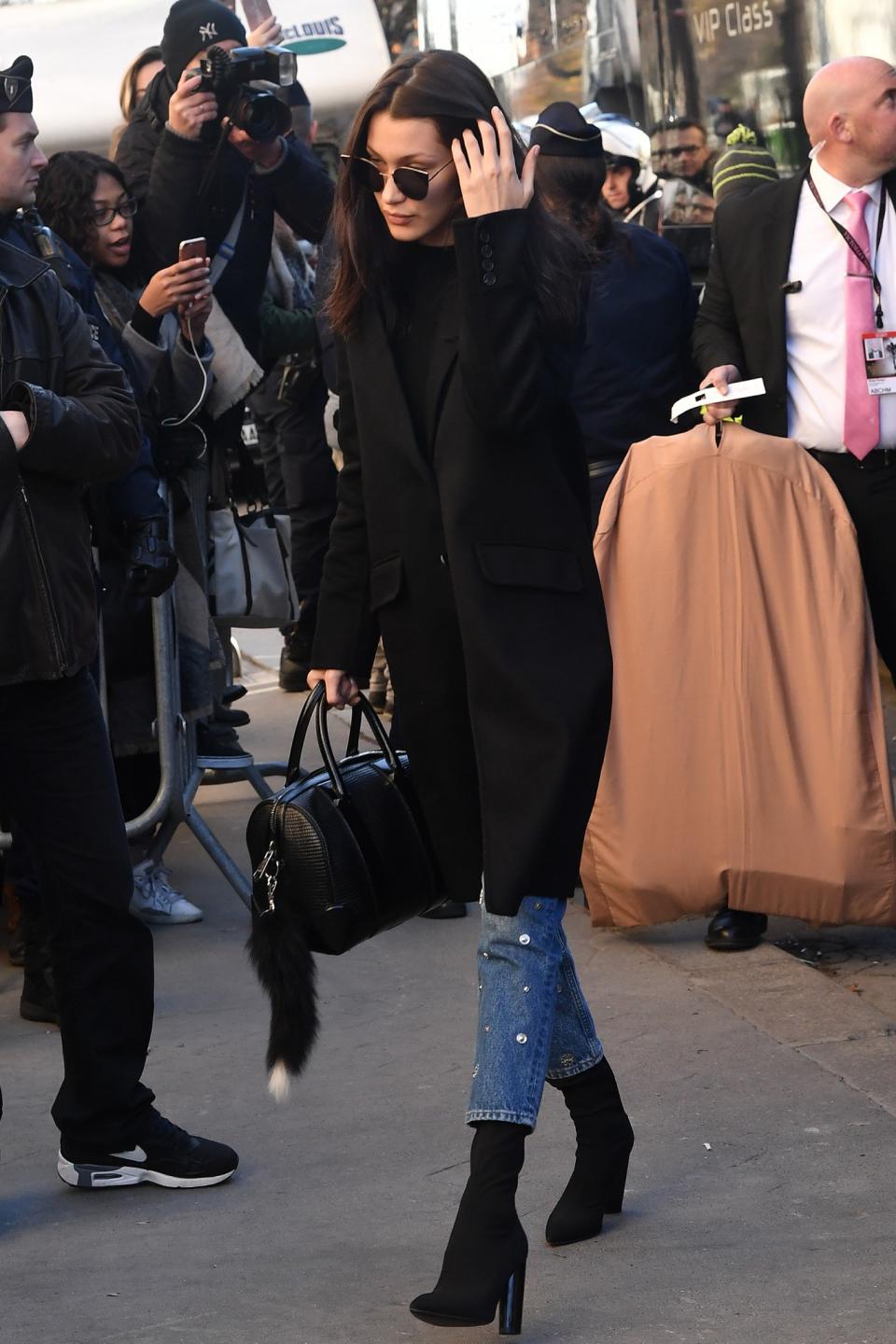 <p>Look closely and you’ll see Bella Hadid’s jeans are covered in circular mirrors. <em>(Photo: Getty Images)</em> </p>