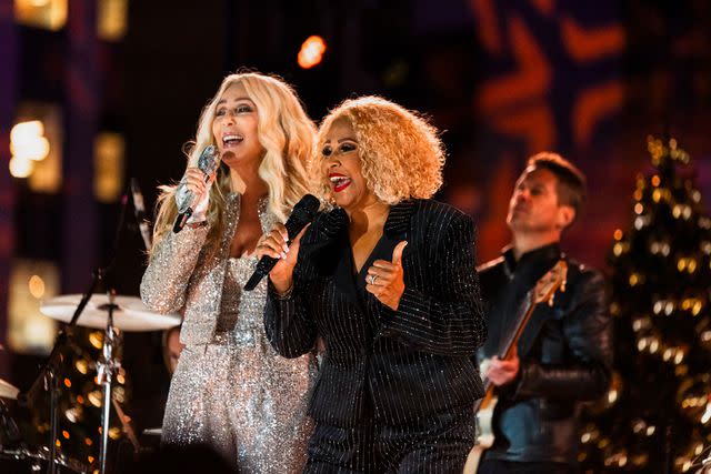 <p>Ralph Bavaro/NBC via Getty</p> Cher and Darlene Love at the 2023 Rockefeller Center Christmas tree lighting