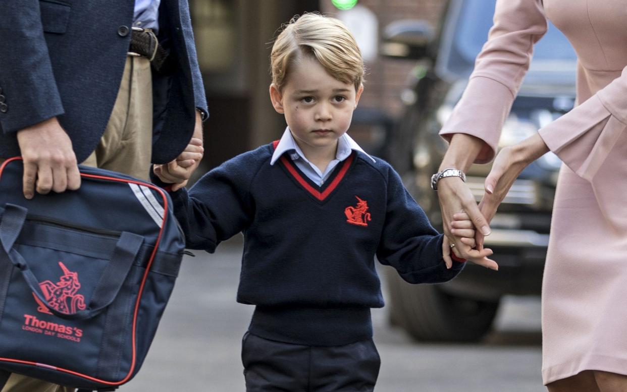 Duke of Cambridge arrives with Prince George for his first day of school  - AFP