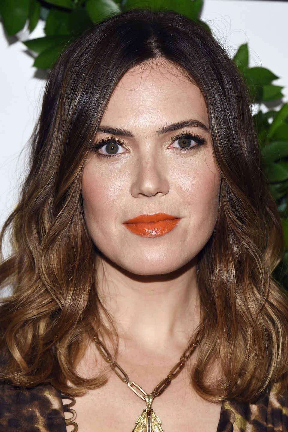 <p>While the idea of tangerine lipstick might give you flashbacks to the '90s, Mandy Moore demonstrates that it is actually a really effective way to add warmth to your complexion. For a flattering shade, try Too Faced's <a rel="nofollow noopener" href="https://www.debenhams.com/webapp/wcs/stores/servlet/prod_10701_10001_154614113899?brand=Too-Faced&cat1=Beauty&cat2=Make-up&cat3=Lipstick&CMP=SSH_2361363232_1069954923_56473038630&gclid=Cj0KCQjwl7nYBRCwARIsAL7O7dE8qesoE2yQE_Vd0rIH5Kh-jI38jFEUtqMH1phZ07ntKRZE_TElFFgaApMtEALw_wcB&gclsrc=aw.ds" target="_blank" data-ylk="slk:Melted Matte Lipstick in Mrs Roper;elm:context_link;itc:0;sec:content-canvas" class="link ">Melted Matte Lipstick in Mrs Roper</a>, £19, or Hourglass' <span>Opaque Rouge Liquid Lipstick in Riviera</span>amp;_$ja=tsid:35948%7ccid:198779374%7cagid:10881905254%7ctid:aud-86322337543:pla-446578154145%7ccrid:40370766334%7cnw:g%7crnd:13739638016041306101%7cdvc:c%7cadp:1o5%7cmt:%7cloc:9072497&gclid=Cj0KCQjwl7nYBRCwARIsAL7O7dEXcAHEnoCEZ5QNmTGHmjuLZOO3skaD521bdvIU2LzJEfW8WcundV4aArCFEALw_wcB&gclsrc=aw.ds"" target="_blank">Opaque Rouge Liquid Lipstick in Rivieraamp;_$ja=tsid:35948%7ccid:198779374%7cagid:10881905254%7ctid:aud-86322337543:pla-446578154145%7ccrid:40370766334%7cnw:g%7crnd:13739638016041306101%7cdvc:c%7cadp:1o5%7cmt:%7cloc:9072497&gclid=Cj0KCQjwl7nYBRCwARIsAL7O7dEXcAHEnoCEZ5QNmTGHmjuLZOO3skaD521bdvIU2LzJEfW8WcundV4aArCFEALw_wcB&gclsrc=aw.ds" target="_blank">Opaque Rouge Liquid Lipstick in Riviera, £25.</p>