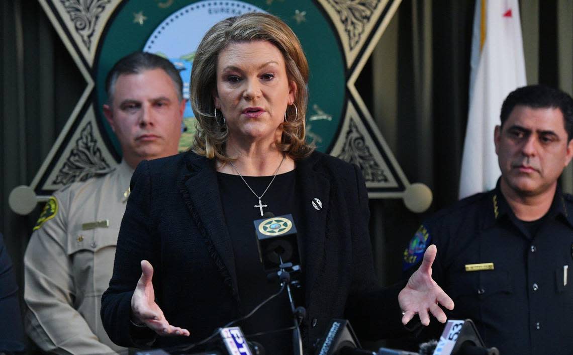 Fresno County District Attorney Lisa Smittcamp, center, flanked by Fresno County Sheriff John Zanoni, left, and Selma Police Chief Rudy Alcaraz, right, releases an update on the killing of Selma police officer Gonzalo Carrasco Jr. at a press conference Friday, Feb 3, 2023 in Fresno.
