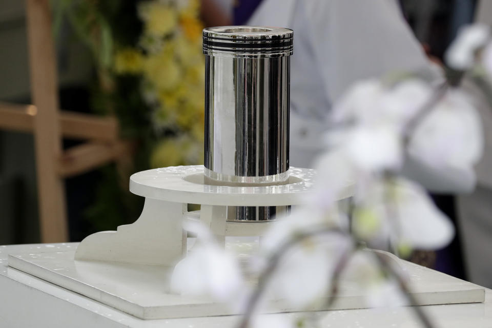 The urn of former Philippine President Benigno Aquino III is seen during state burial rites on Saturday, June 26, 2021 at a memorial park in suburban Paranaque city, Philippines. Aquino was buried in austere state rites during the pandemic Saturday with many remembering him for standing up to China over territorial disputes, striking a peace deal with Muslim guerrillas and defending democracy in a Southeast Asian nation where his parents helped topple a dictator. He was 61. (AP Photo/Aaron Favila)