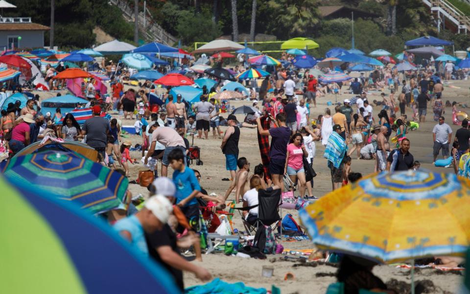 Visitors crowd the beach during the Memorial Day holiday weekend as Southern California sees a relaxing of restrictions  - EUGENE GARCIA/EPA-EFE/Shutterstock 