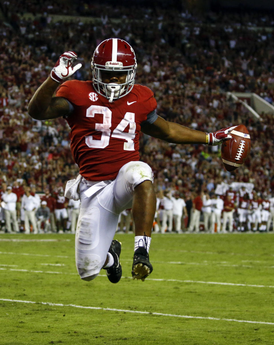 Alabama running back Damien Harris (34) leaps into the end zone for a touchdown during the second half of an NCAA college football game against Missouri, Saturday, Oct. 13, 2018, in Tuscaloosa, Ala. Alabama won 39-10. (AP Photo/Butch Dill)