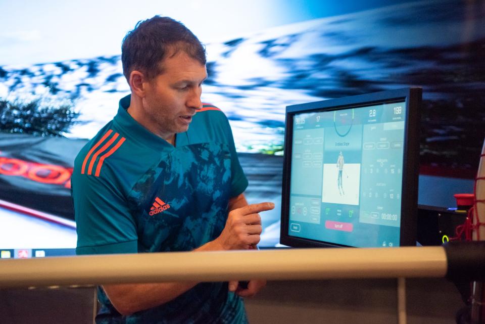 Andrey Yunusov, founder of 4SeasonAlpine, a new indoor ski and snowboard school in Doylestown Borough, adjusts the settings of the virtual simulator offered at his facility.