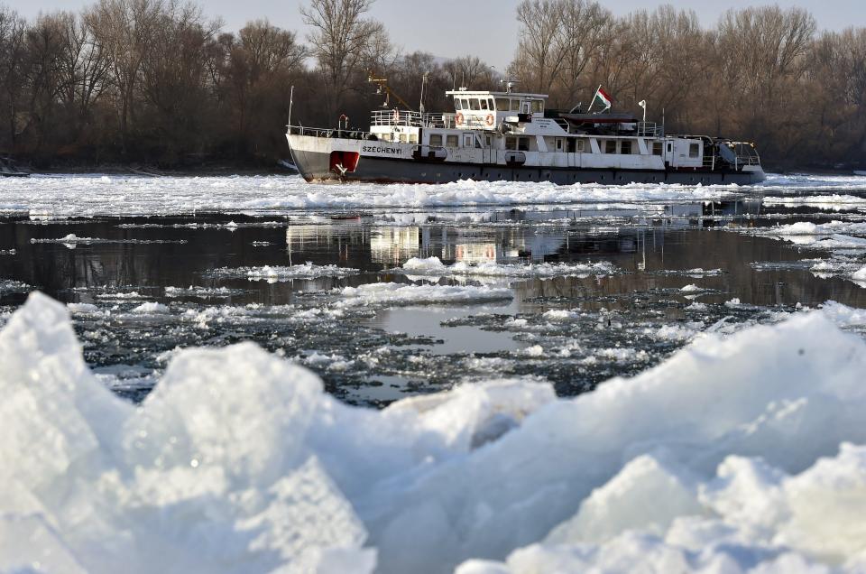 An ice breaking ship cuts thick floes on River Danube near Dunakeszi, just north of Budapest on its way to the Hungarian capital from Gonyu, 108 kms west of Budapest, Hungary, Wednesday Jan. 11, 2017. (Zoltan Mathe/MTI via AP)