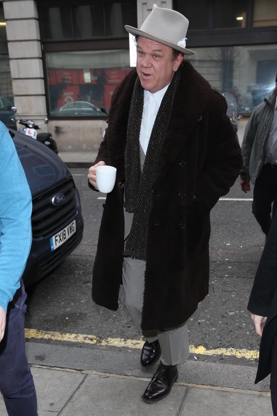 John C. Reilly’s gear, ranked:
4. Herringbone scarf
3. Felt hat
2. Giant furry coat

Coffee mug
