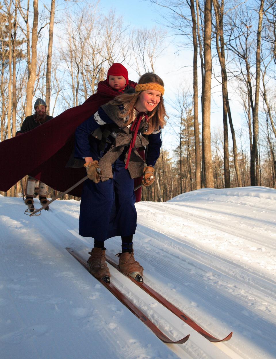 Jocie Nelson skiing the Birkie with her infant son on her back.