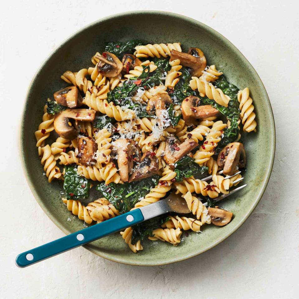 <p>Loading up your pasta with vegetables like the kale and mushrooms here is not only delicious, it also makes the meal more satisfying. <a href="https://www.eatingwell.com/recipe/7939117/chickpea-pasta-with-mushrooms-kale/" rel="nofollow noopener" target="_blank" data-ylk="slk:View Recipe" class="link ">View Recipe</a></p>