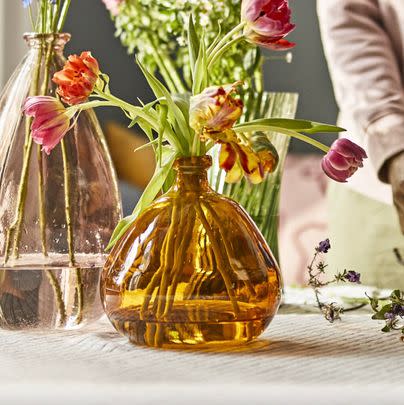 If you’re getting flowers, consider bringing them in a brand new vase or jug