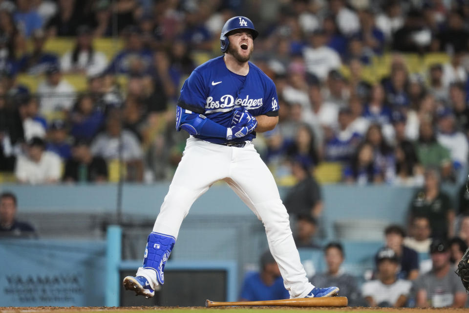 Los Angeles Dodgers' Max Muncy (13) reacts after being hit by a pitch during the fifth inning of a baseball game against the Oakland Athletics in Los Angeles, Thursday, Aug. 3, 2023. (AP Photo/Ashley Landis)
