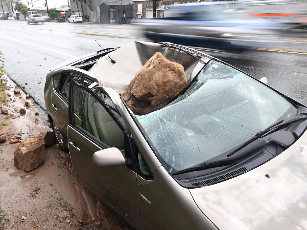 A boulder crashed on top of a parked car along P.C.H. in Malibu on January 10 after a storm passed through.