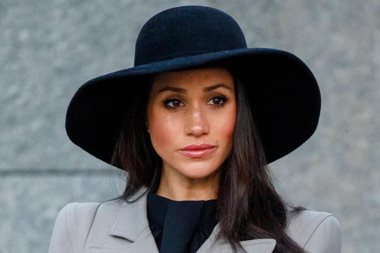 Meghan Markle, the US fiancee of Britain's Prince Harry, attends an Anzac Day dawn service at Hyde Park Corner in London on April 25, 2018.